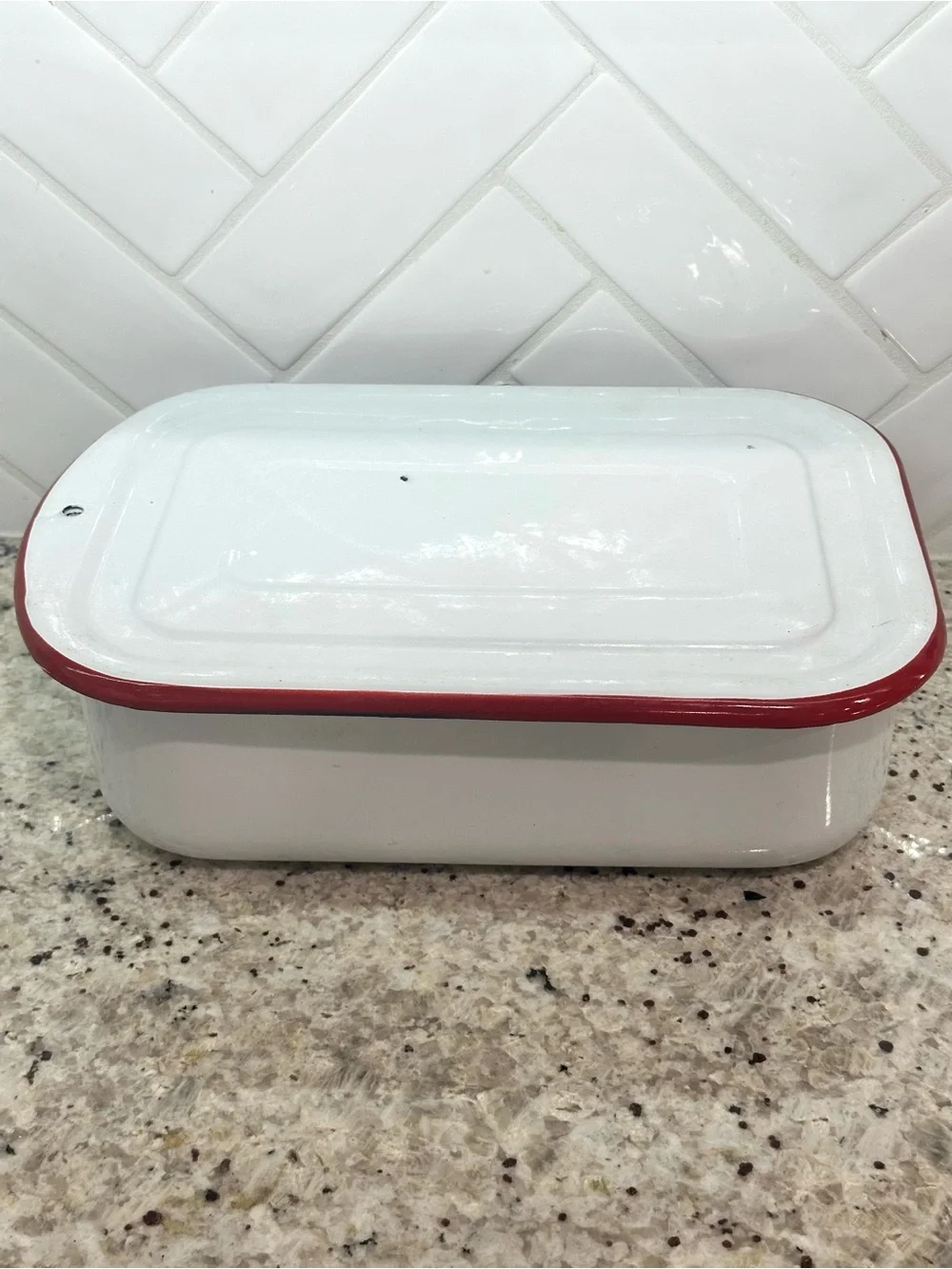Vintage white enamel pan with red trim